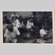Group sitting on ground at picnic (ddr-densho-464-67)