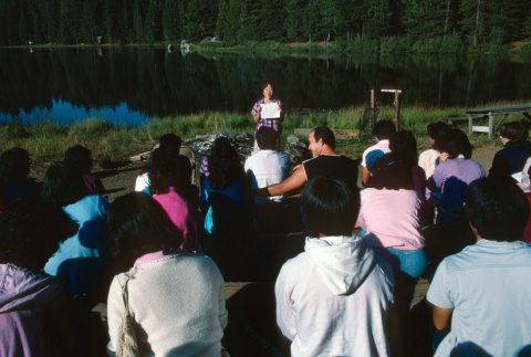 Campers listening to a talk on the lakefront (ddr-densho-336-1466)