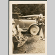 Woman by row of cars (ddr-densho-316-194)