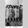 Group of five women posing for photo on sidewalk (ddr-ajah-6-429)