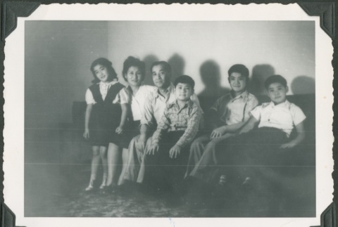 A family sitting on a couch (ddr-densho-328-375)