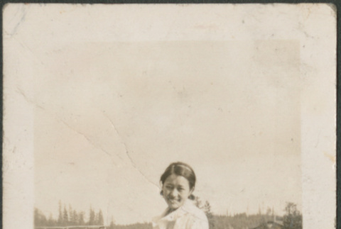 Woman standing on dock (ddr-densho-316-184)