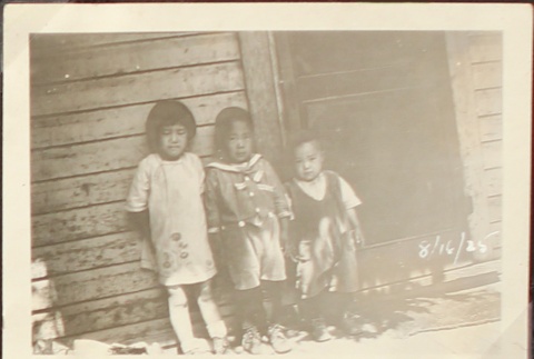 Nisei children by doorway (ddr-densho-259-451)