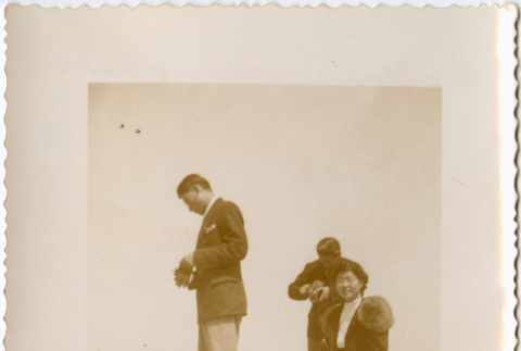 Three people by low wall (ddr-densho-426-1959)
