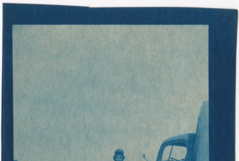 Man standing by a truck (ddr-densho-329-1379)