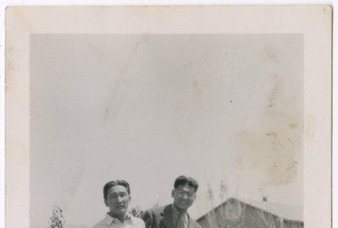 Two men leaning on wall (ddr-densho-329-1326)
