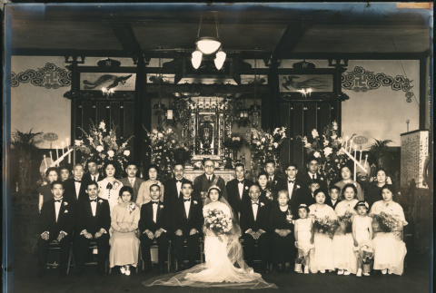 Wedding party sits in front of a shrine (ddr-densho-395-6)