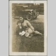 A woman and girl sitting on grass (ddr-densho-321-680)