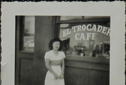 Woman standing in front of the El Trocadero Cafe (ddr-densho-321-1243)