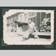 Man sitting on a bench (ddr-densho-471-51)