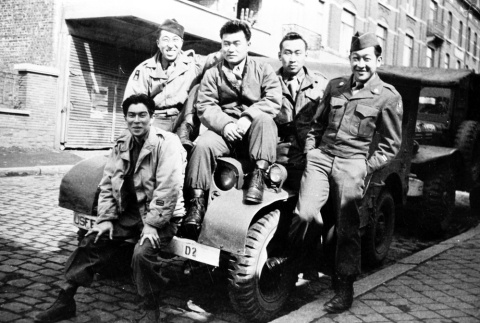 Soldiers sitting on a truck (ddr-densho-5-1)
