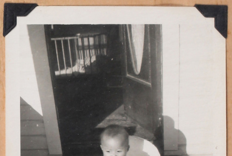 Photo of baby by front door (ddr-densho-483-433)