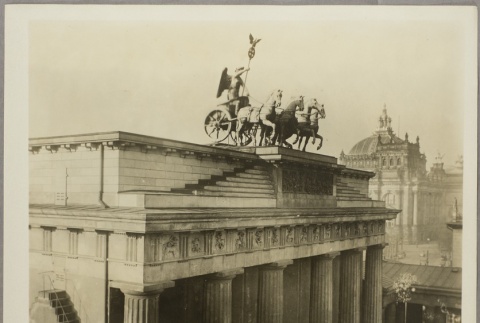 Statue of horses and chariot rider on top of a building (ddr-njpa-13-1568)