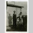Issei couple in front of house (ddr-densho-182-61)