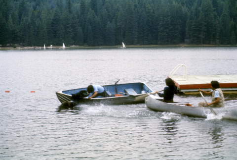 Stuart Wong trying to retrieve a bag in the water (ddr-densho-336-883)