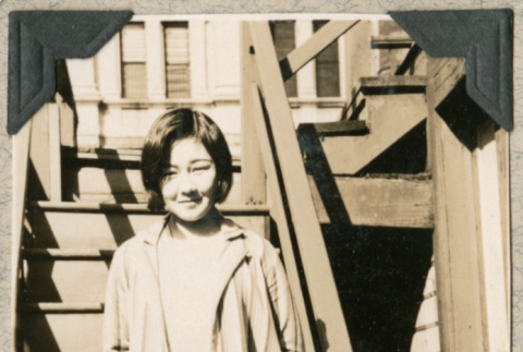 Hatsue Aoki standing on staircase (ddr-densho-383-48)
