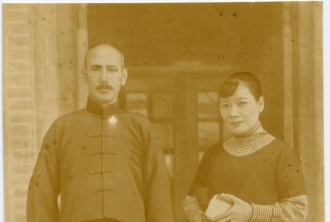 A man and woman standing in a doorway (ddr-njpa-1-1720)