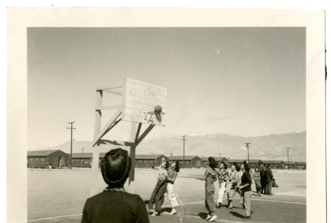 Photograph of girls playing basketball at Manzanar (ddr-csujad-47-45)