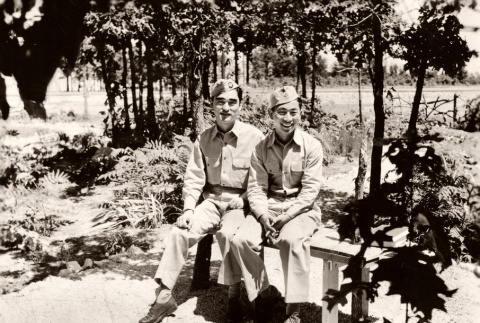Two men sitting on bench in garden (ddr-ajah-2-786)