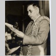 Man wearing leis reading speech (ddr-njpa-2-868)