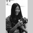 Lynn Hikiko holding a camera (ddr-densho-336-637)