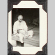Seated man with baby (ddr-densho-355-836)