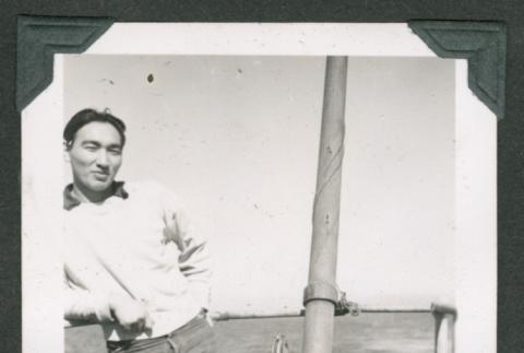 Man leaning on railing (ddr-densho-540-104)