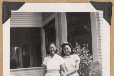 Two girls holding hands (ddr-densho-542-226)