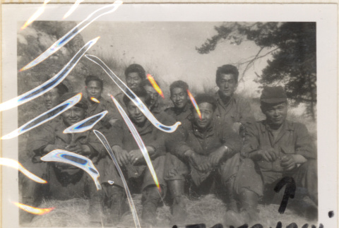 Ten soldiers sitting on hillside (ddr-densho-466-243)