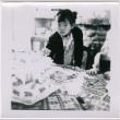 Masako Takahashi at a table with cake (ddr-densho-426-994)