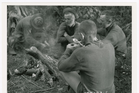 A group of Merrill's Marauders gathered around campfire (ddr-densho-1007-236)
