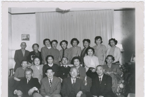 (Photograph) - Image of men and women seated and standing in room (Front) (ddr-densho-330-292-mezzanine-c2cc893efc)