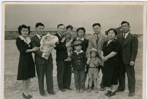 Group of 10 people at Minidoka, including the Sakura family (ddr-densho-523-137)