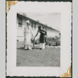 Two African American men in aprons with dog.  Edgar Jett on left (ddr-densho-434-177)
