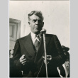 Man speaking at microphone (ddr-densho-426-983)