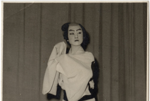 Performer on stage in costume (ddr-densho-426-871)