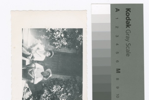 Japanese American men on steps (ddr-densho-255-113)