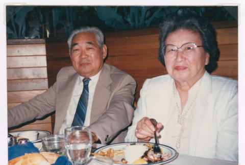 Takeo and Mitzi Isoshima at dinner (ddr-densho-477-524)