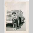 Girl standing in front of car (ddr-densho-470-4)