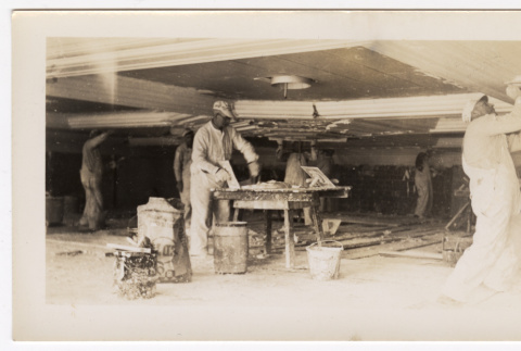 Crew works on ceiling plaster work at the temple construction site (ddr-sbbt-4-146)
