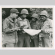 Members of 442nd studying map of bivouac area in France (ddr-densho-1007-204)