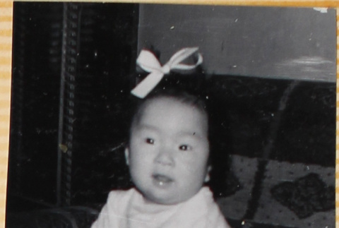 Baby with bow in her hair (ddr-densho-522-30)