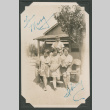 Signed photo of three girls and a boy in a pickup truck (ddr-densho-483-252)