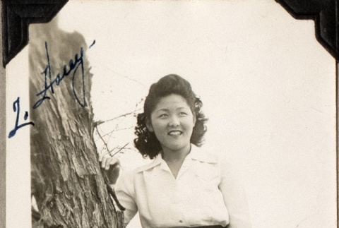 Woman standing by tree (ddr-densho-587-51)