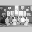 Women sitting in front of an art exhibit (ddr-fom-1-688)