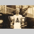 Man holding trophies (ddr-njpa-4-2328)