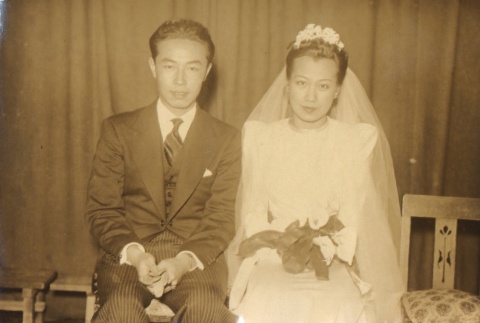 Bride and groom seated, posing in Western clothes (ddr-njpa-4-21)