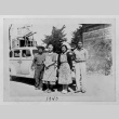 Four figures with car (ddr-densho-1007-55)
