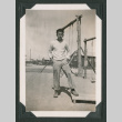 Man stands by swings (ddr-densho-471-53)