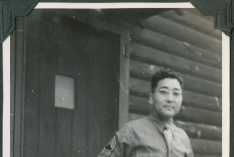 Man standing outside barracks (ddr-ajah-2-437)